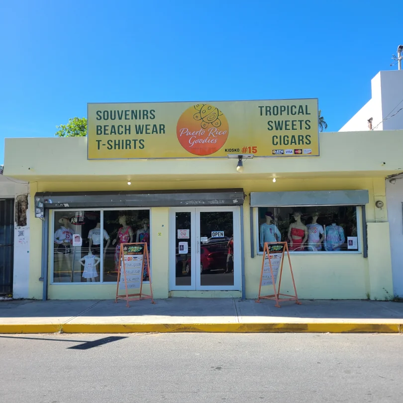 The front of Kiosk #15 Puerto Rico Goodies, a giftshop that sells souvenirs, clothing, cigars, sweets and other trinkets.