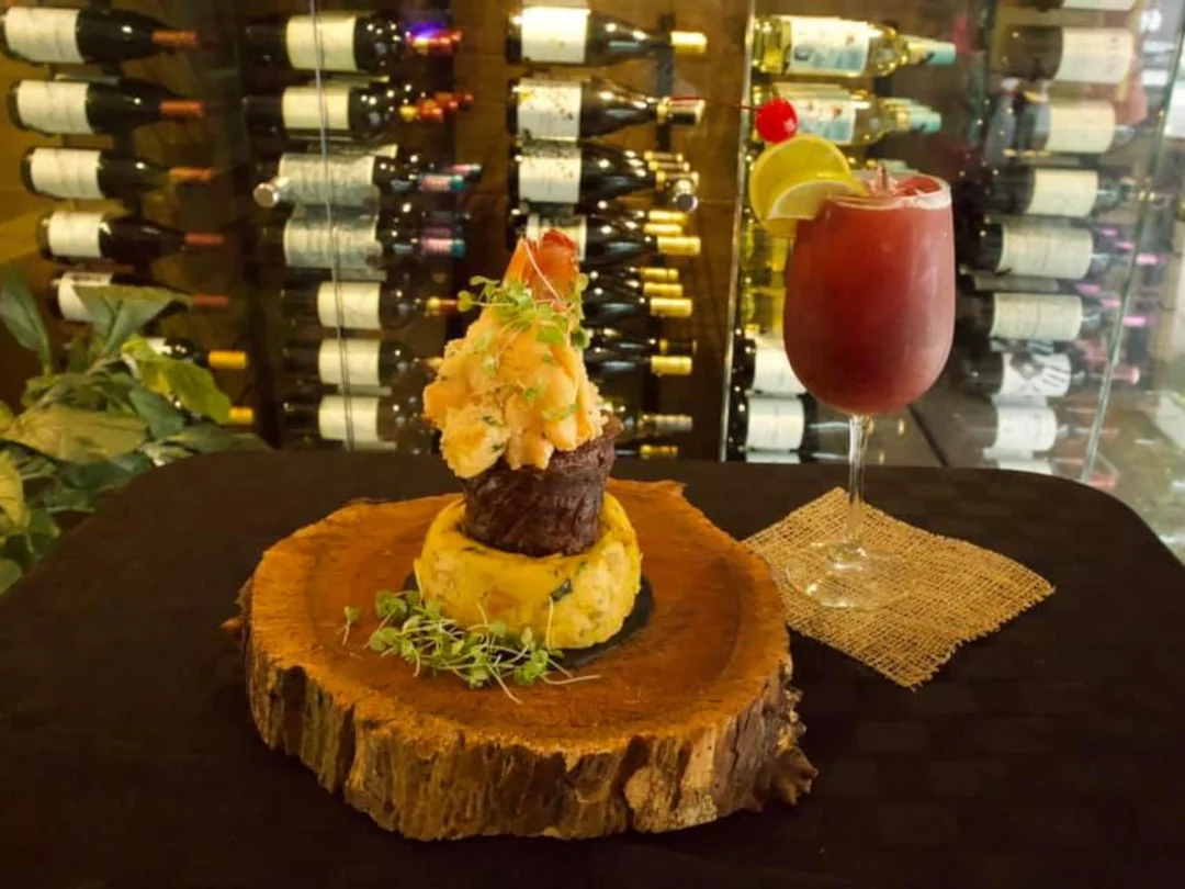 Mofungo with skirt steak and a handcrafted drink available at Jibaro's Borinquen Restaurant
