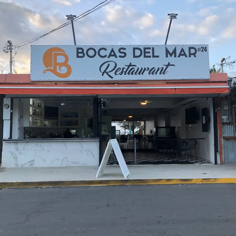 The front of Bocas Del Mar kiosk #24, offering seafood and traditional puerto rican food.