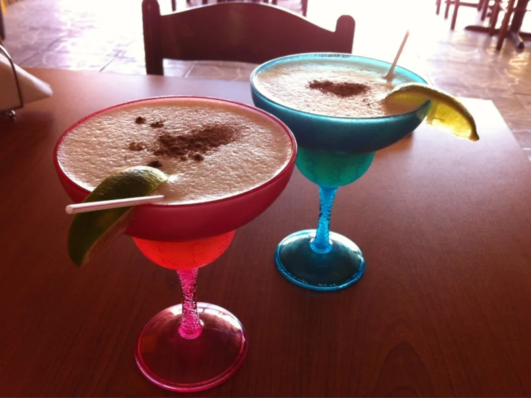 Two mixed drinks made from the full bar at Ceviche Hut Peruvian Cuisine.