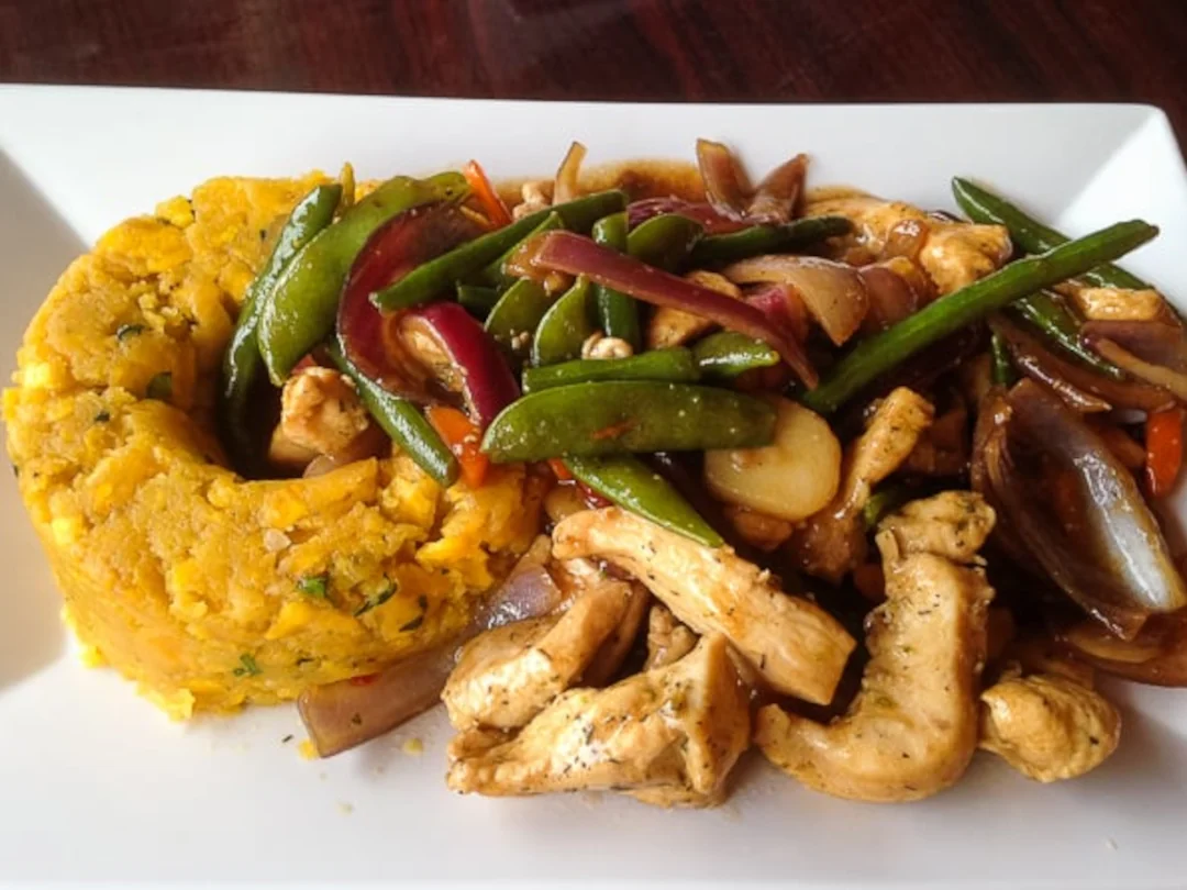 Mofongo with chicken and sauteed vegetables available at Ceviche Hut Peruvian Cuisine.