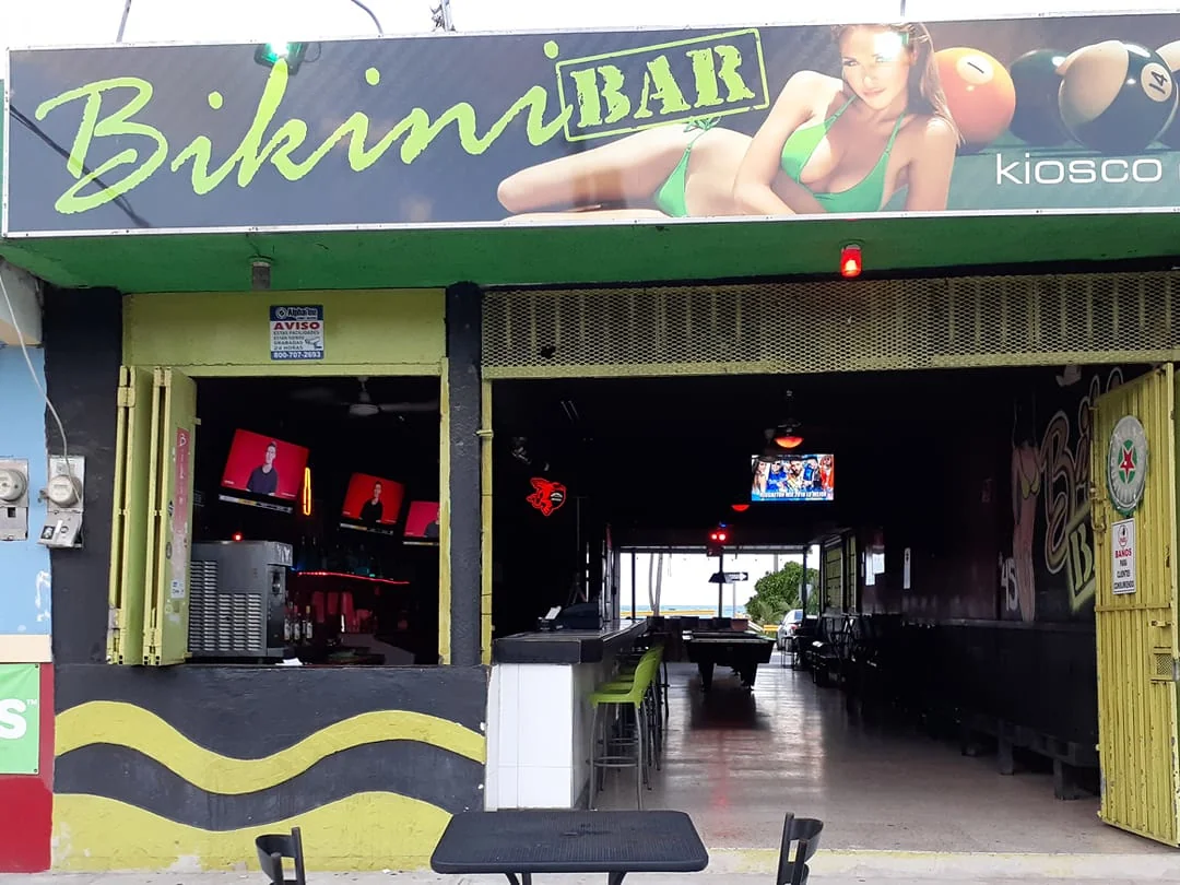 The front of Bikini Bar kiosk. With multiple TV's for sporting events and pool tables available. Open late.