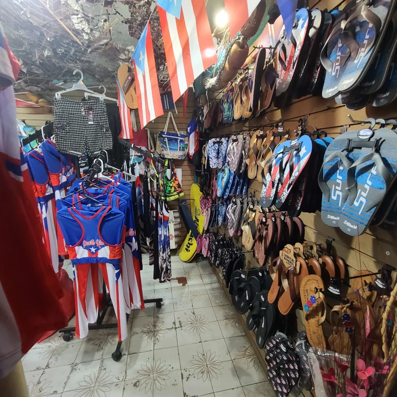 A whole wall of sandals and beach gear available at Beach Banana Souvenirs.