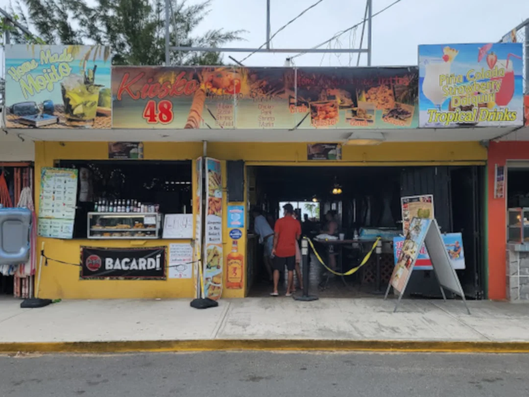 The front of Gringo's bar and Grill kiosk #48 offering walk up service and traditional Puerto Rican food.